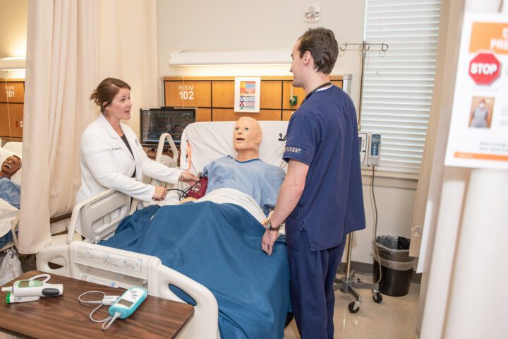 College of Nursing faculty members provide one-on-one instruction.